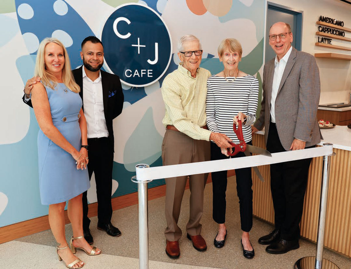 Ribbon cutting ceremony for the opening of the C + J Cafe