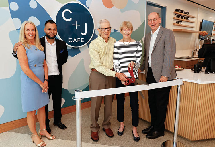 Ribbon cutting ceremony for the opening of the C + J Cafe